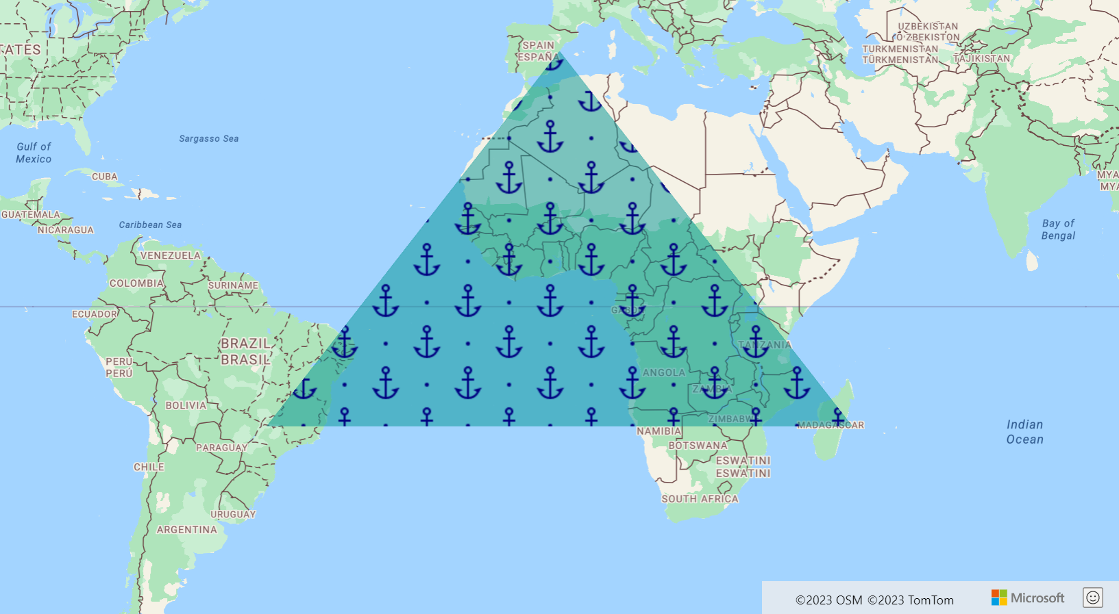 لقطة شاشة تعرض خريطة تعرض طبقة مضلع في شكل مثلث أخضر كبير مع صور متعددة للارتساءات الزرقاء بداخلها.