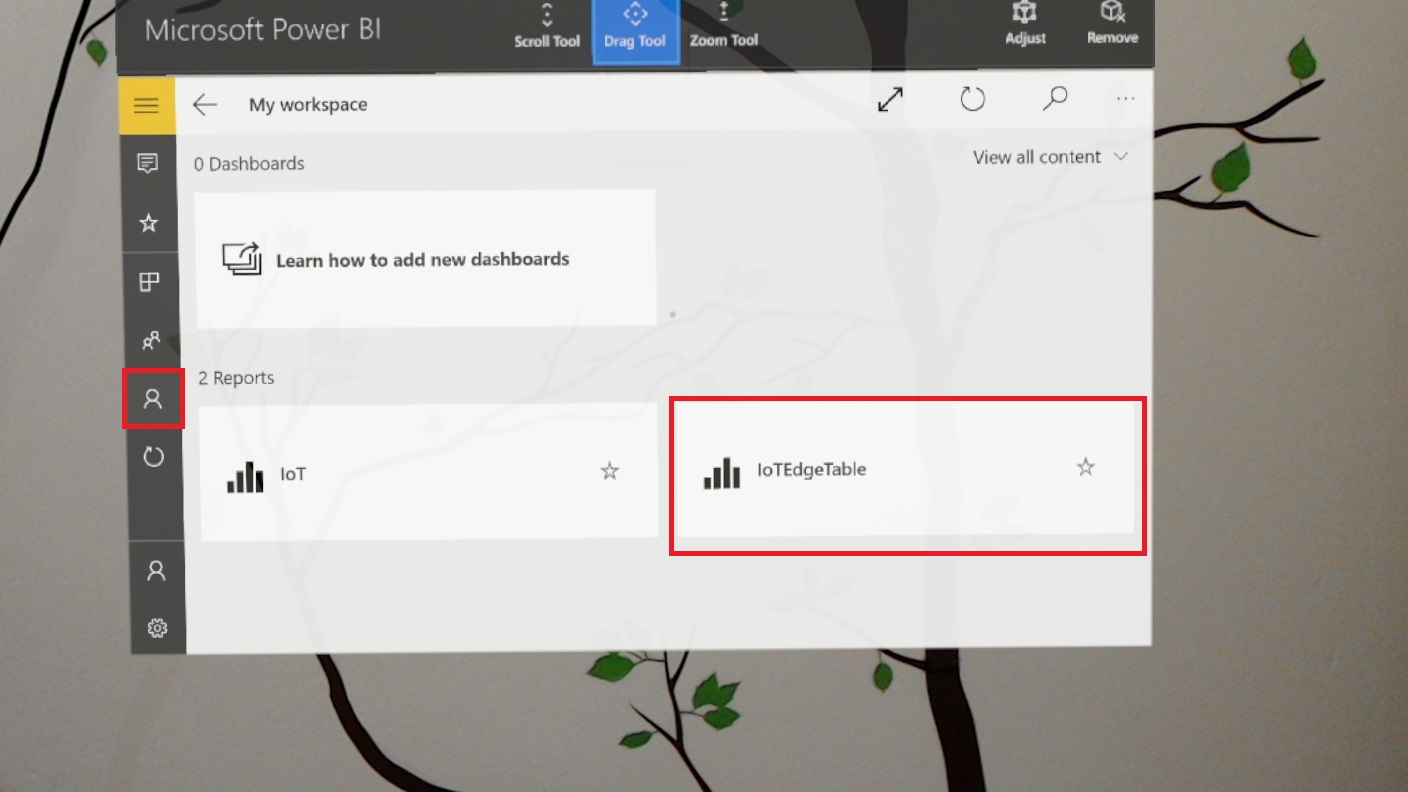 Holo Lens display that shows the Microsoft Power B I page. Drag Tool is selected at the top. The workspace icon, which resembles a figure, is circled in red. I O T Edge Table under Reports is circled in red.