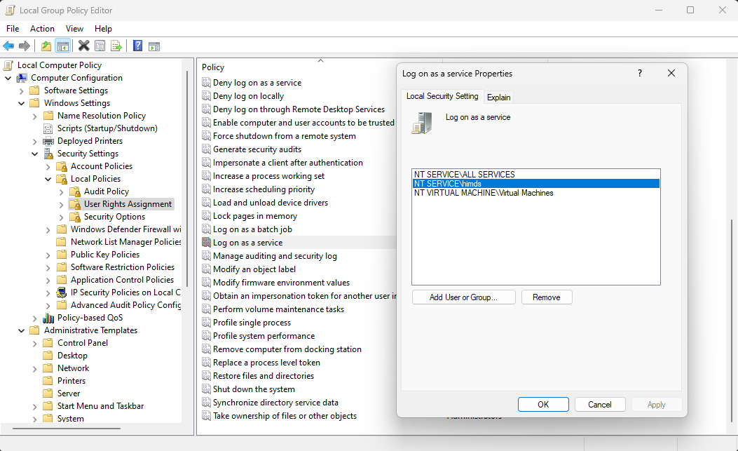 Screen capture of the Local Group Policy Editor showing which users have permissions to log on as a service.