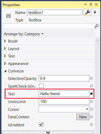 Screenshot that shows the Common menu expanded in the Properties window, with Hello there entered in the Text property.