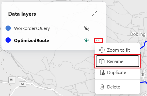 Et screenshot af Microsoft Fabric Maps Data-lagpanelet, der viser to lag: WorkordersQuery og OptimizedRoute. Lagget OptimizedRoute har sin indstillingsmenu udvidet med et rødt rektangel, der fremhæver Rename-muligheden. Andre synlige menumuligheder inkluderer Zoom for at tilpasse, Dupliker og Slet. Panelet vises over en baggrund over gadekortet, der viser Wien, Østrig-området.