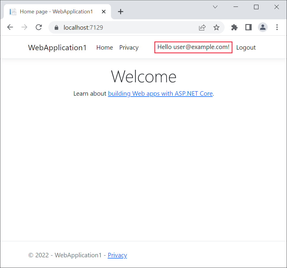 Die Webanwendung ist in Microsoft Edge geöffnet. Der Link „Registrieren“ wird durch den Text „Hello user1@example.com!“ ersetzt.