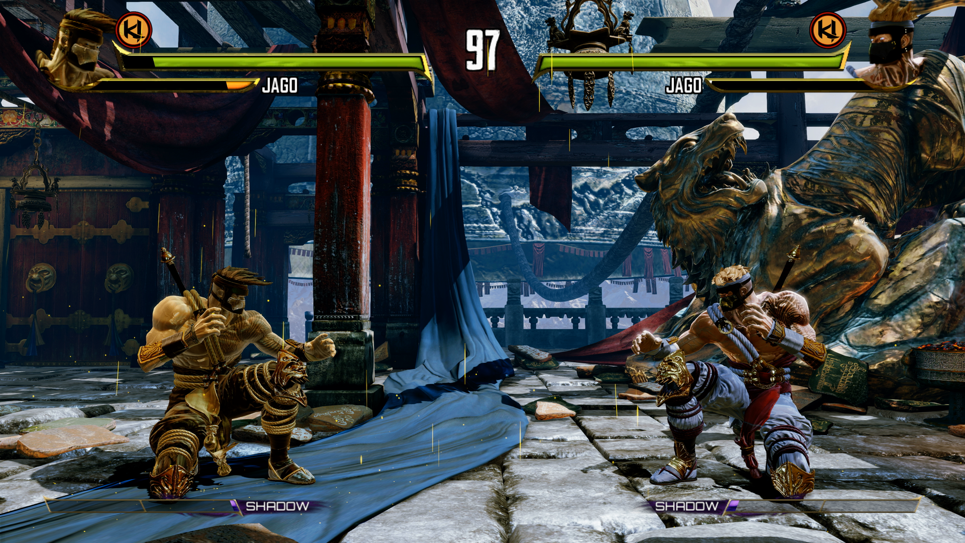 A battle between two characters in Killer Instinct. They're squatting with fists up on opposite sides of the arena. 