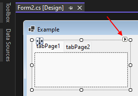The Windows Forms designer in Visual Studio showing a tab control's smart tag button.