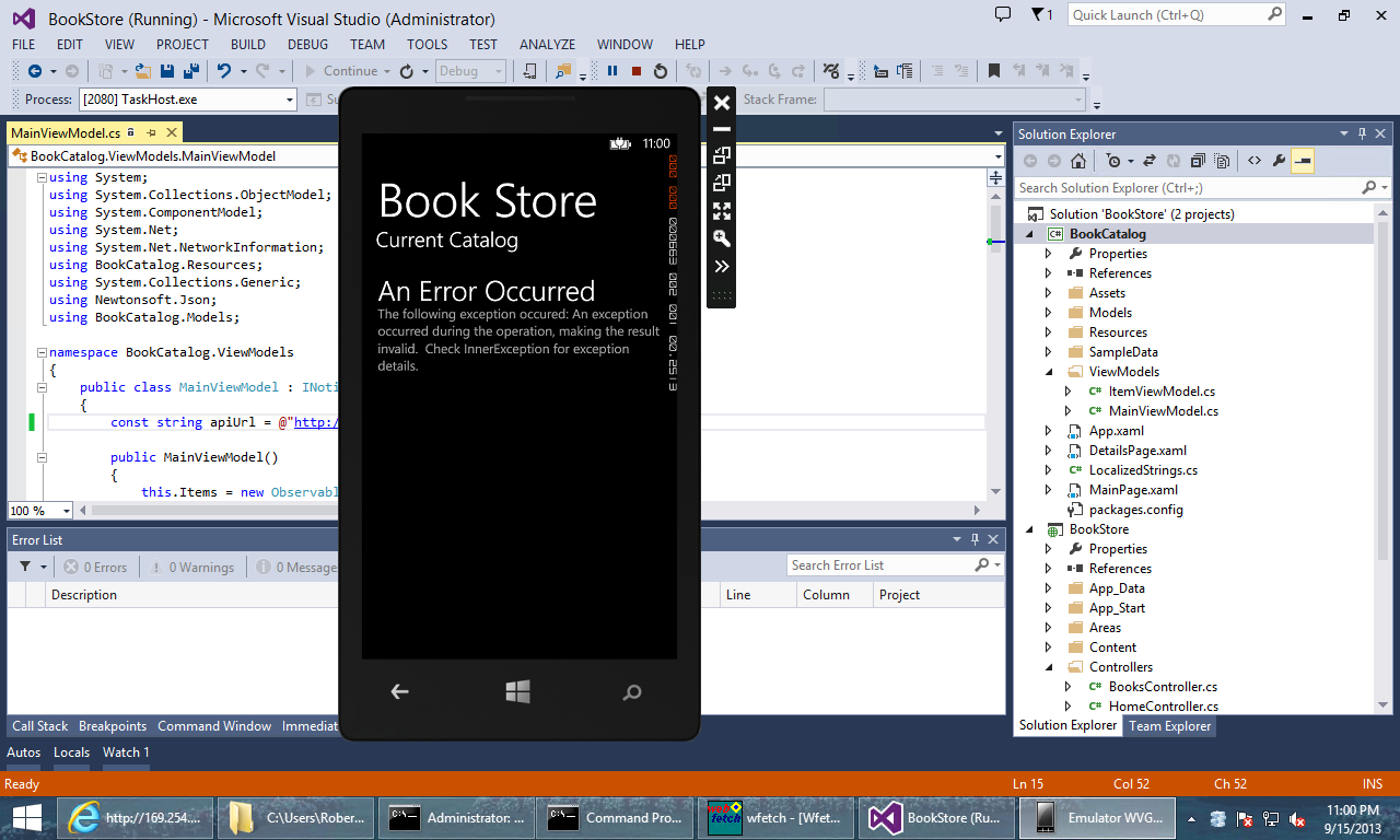 Screenshot of the phone emulator, displayed over the solution explorer window, showing an 'An Error Occurred' and a brief description of the error.