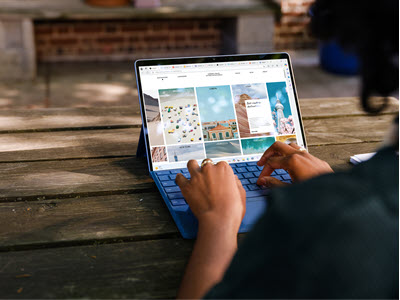Screenshot of a person typing on a tablet.