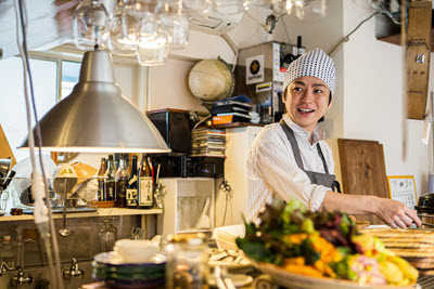 Screenshot of person cooking in a kitchen.