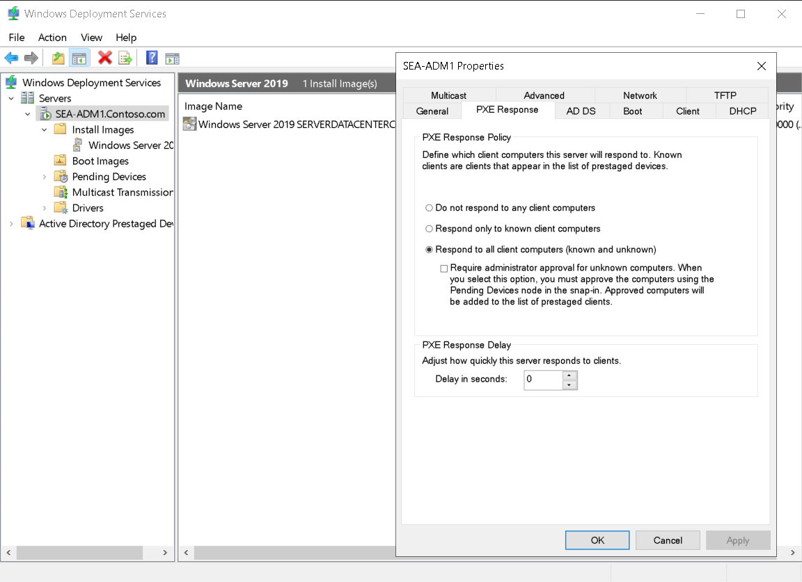 A screenshot of the Windows Deployment Services console with the SEA-ADM1 Properties dialog box overlaid. The administrator has selected the PXE Response tab, and has selected Respond to all client computers (known and unknown).