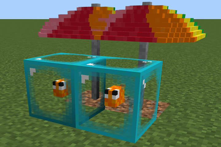 An image showing two bubble blocks containing fish and covered by an umbrella.