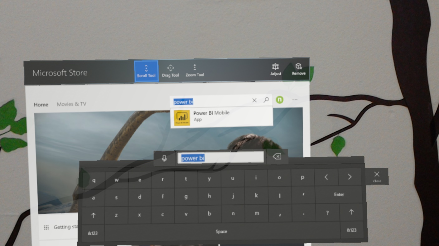 Holo Lens display that shows the Microsoft Store page. Scroll Tool is selected and power B I is entered in the search bar.