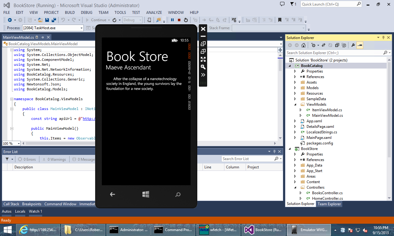 Screenshot of the phone emulator, over the solution explorer window, displaying a book title and description.