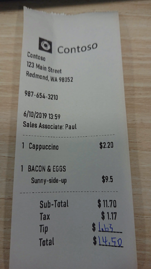 Photograph shows a printed receipt from Contoso.