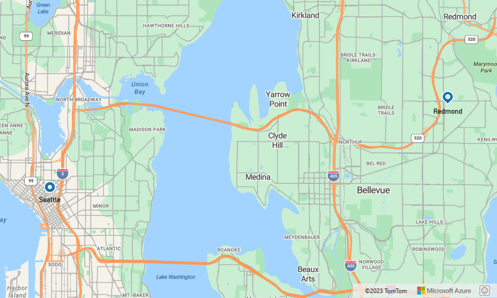 A screenshot showing a map with a route containing a blue teardrop pin marking the start point at Microsoft in Redmond Washington and a blue round pin marking the end point at a gas station in Seattle.