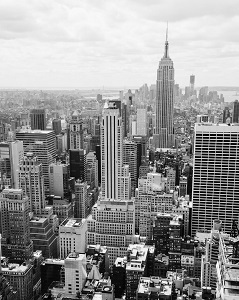 A black and white picture of buildings in Manhattan