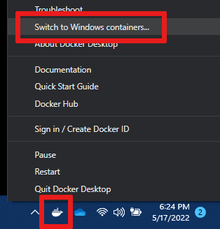Screenshot of how to find and select the menu item named 'Switch to Windows containers'.