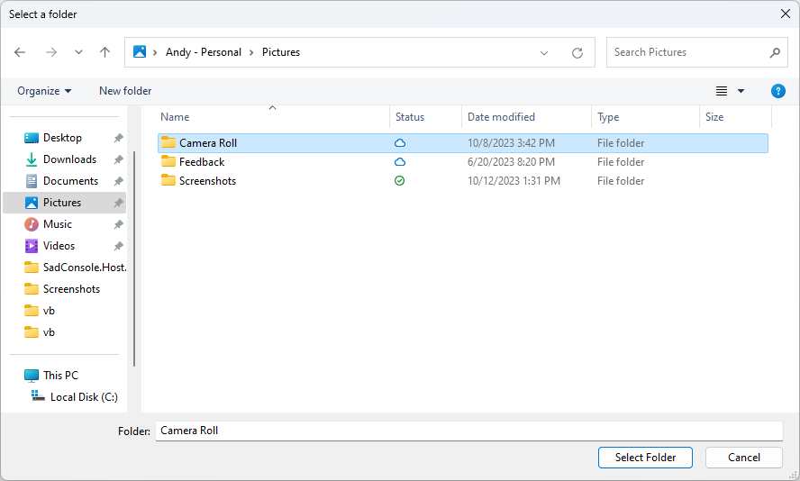 An Open Folder dialog box showing the Pictures folder with the Camera Roll folder selected, shown from a WPF application.