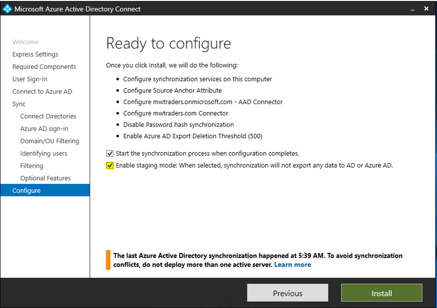 Screenshot of the Microsoft Entra Connect window. The page is titled Ready to configure, and the Enable staging mode checkbox is selected.