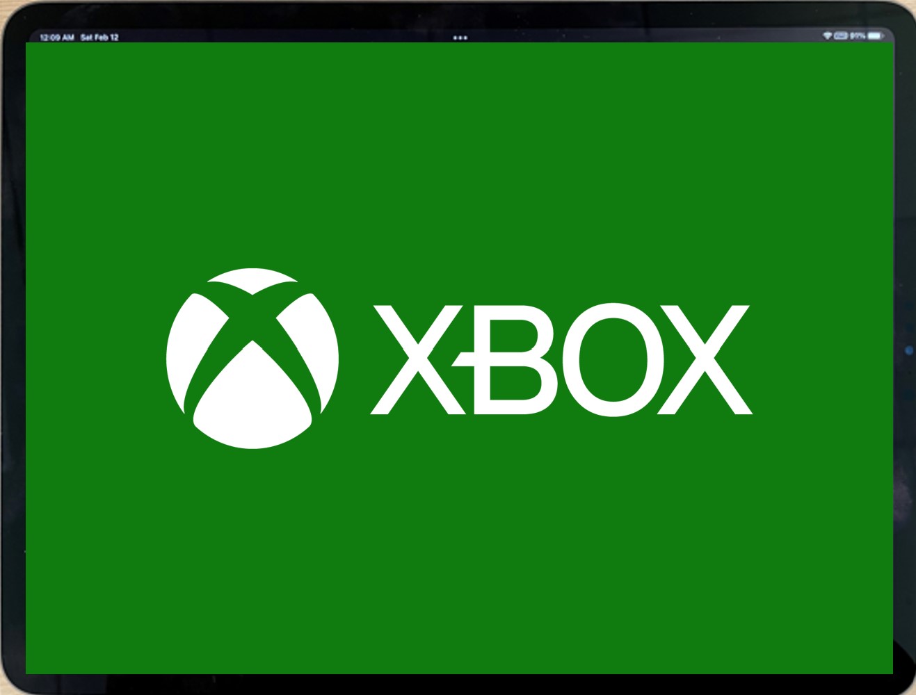 The Xbox logo filling the screen of a landscape tablet