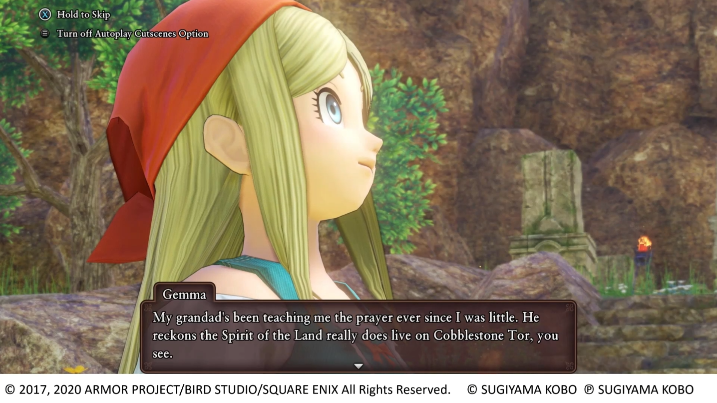 Dragon Quest XI S: Echoes of an Elusive Age screen shot of Gemma speaking to Eleven during a cut scene. In the top left corner is an X button icon with text saying "Hold to skip" and below that a Menu button icon with text saying "Turn on Autoplay cutscenes option". Copyright on the bottom says "2017, 2020 Armor Project / Bird Studio / Square Enix All Rights Reserved. Sugiyama Kobo. Sugiyama Kobo.