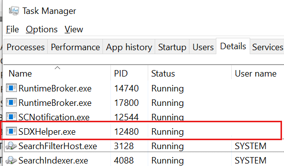 Screenshot shows the SDXHelper.exe process in Task Manager.