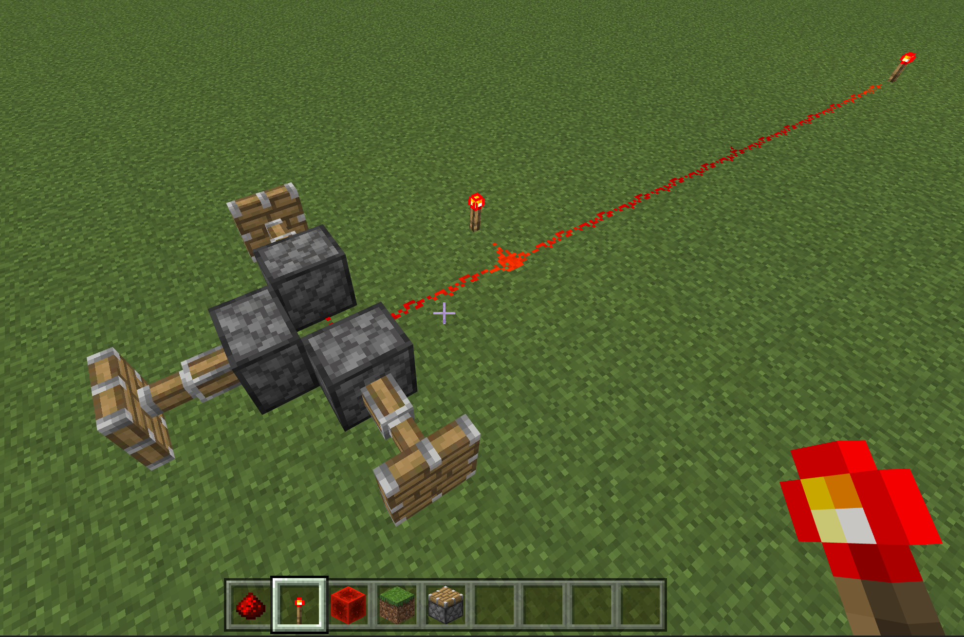 Image of a redstone torch boosting the signal and activating pistons