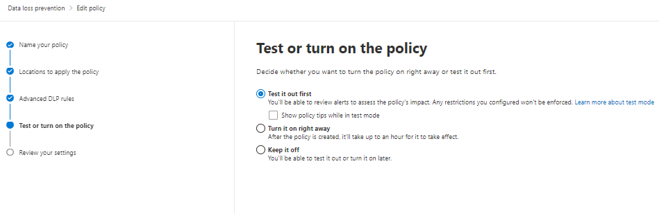 Screenshot of the window titled Test or turn on the policy. The status titled Test it out first is highlighted in the policy status.