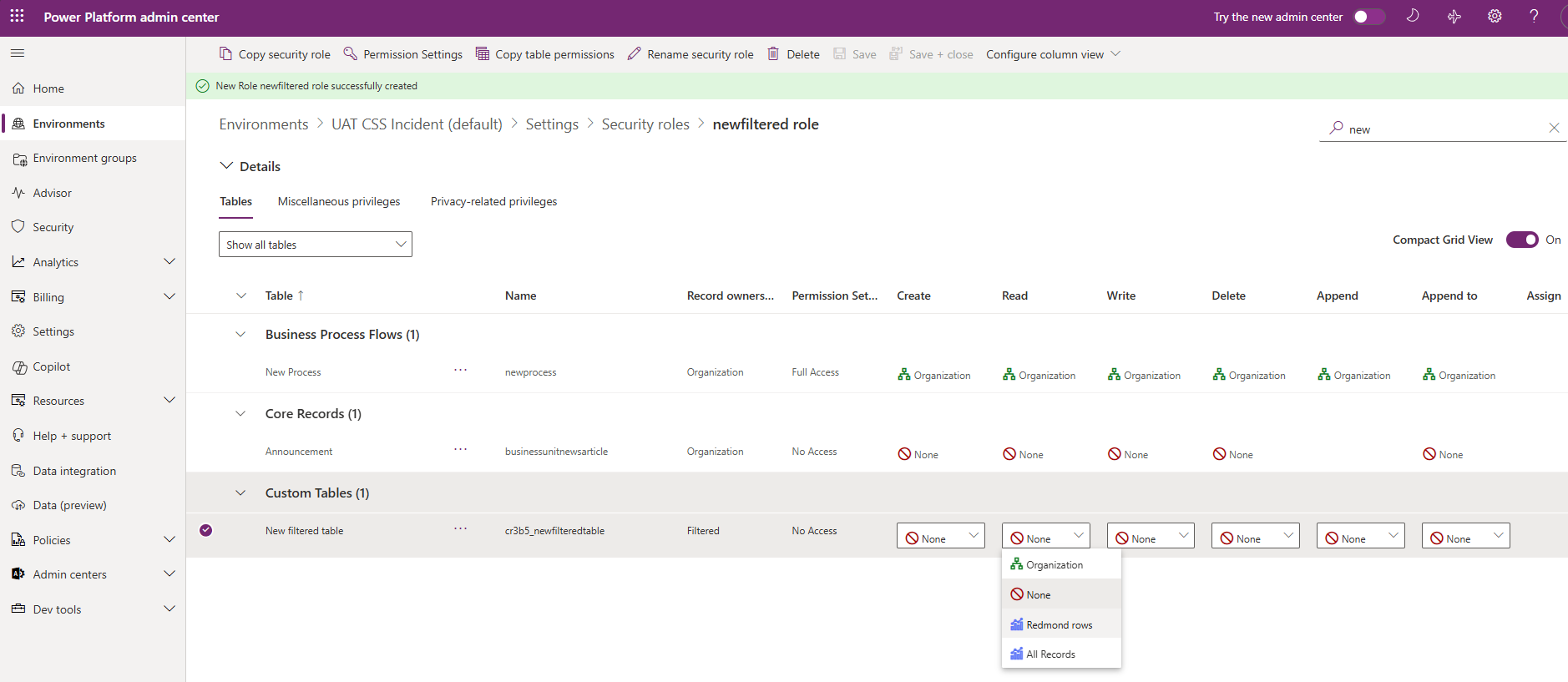 Screenshot of the security role configuration showing the Redmond rows filter granted to the Read privilege.
