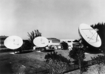 Figure 7.20: Americatel's U.S. teleport consists of three large-diameter satellite dishes. (Courtesy of Americatel Corporation)