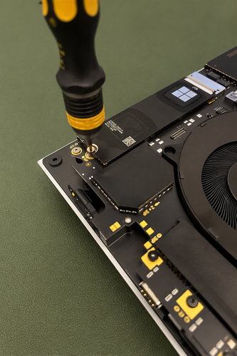 Screenshot that shows the removable solid-state drive and its retaining screw.