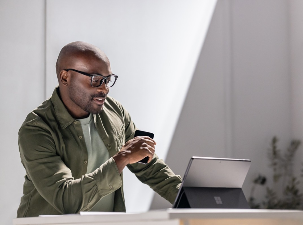 Photo of an instructor working on a Surface tablet.