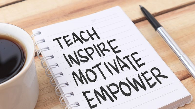 Image of a notebook that says Teach, Inspire, Motivate, and Empower