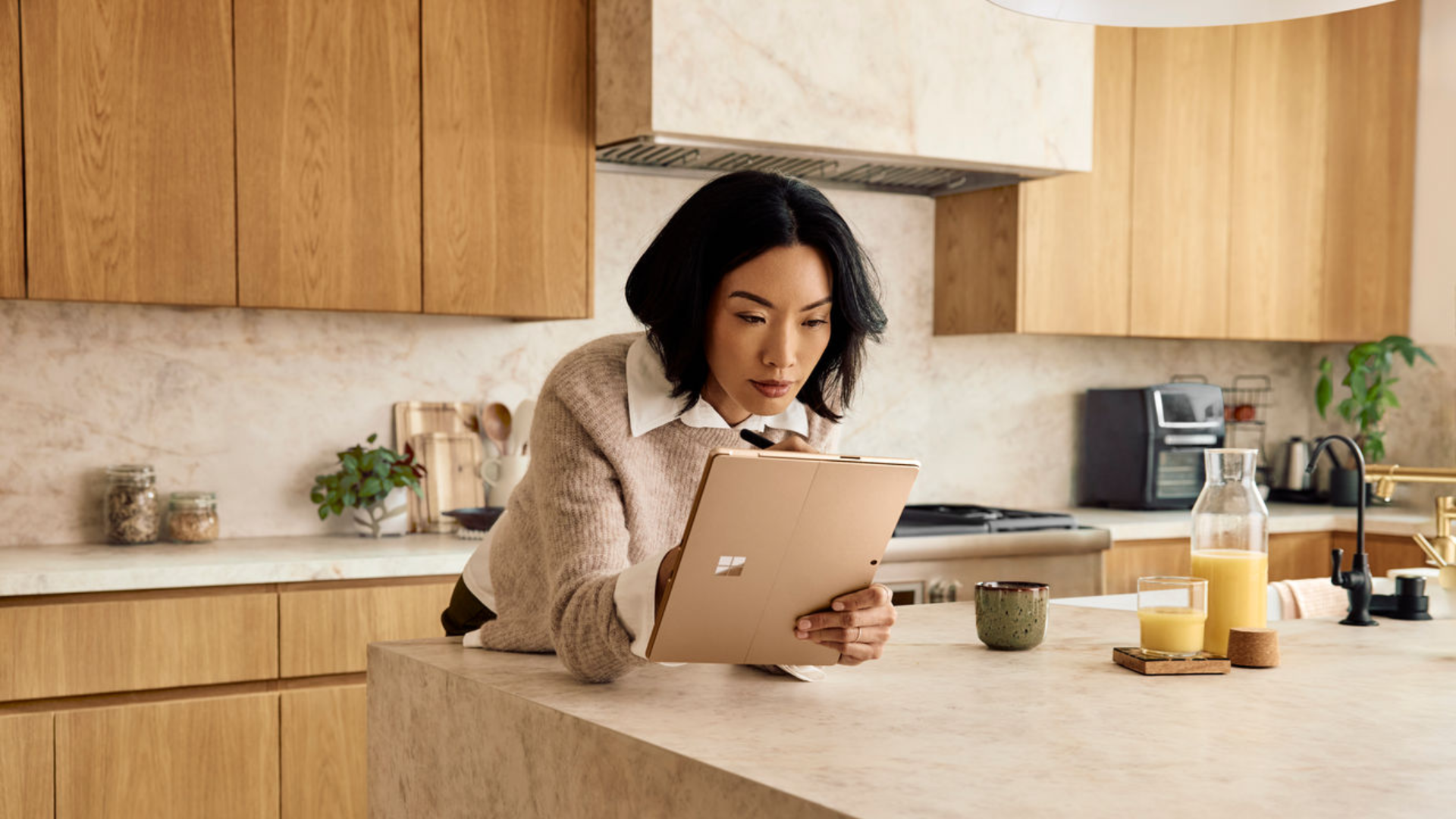 Photo of person using Microsoft 365 productivity apps on a Microsoft Surface Pro.