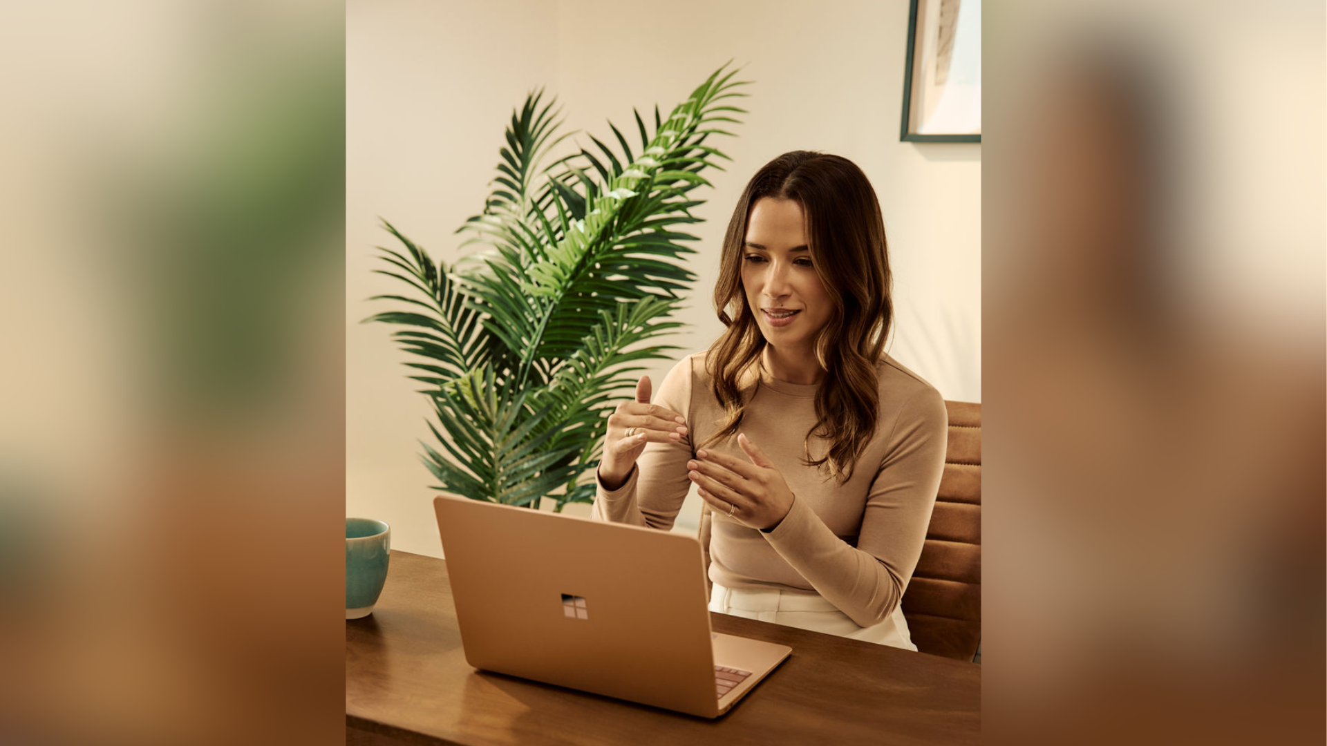 Photo of person using Microsoft PowerPoint on a Microsoft Surface Laptop device.