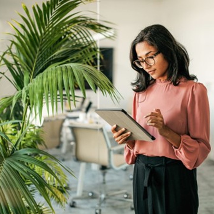 Photo of a person looking at their laptop.