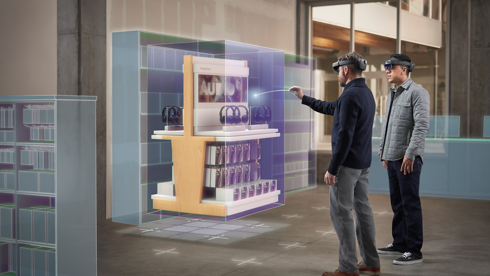 Photograph of two users wearing HoloLens headsets and interacting with a stationary hologram.