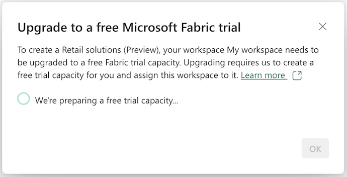 Screenshot of the Upgrade to a free Microsoft Fabric trial pop-up window.