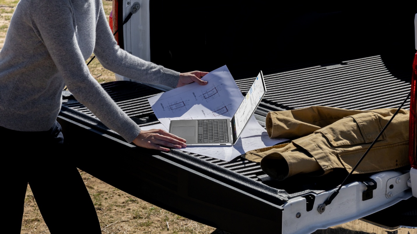 Photo of a Surface Laptop being used in a field setting on the bed of a pickup truck.