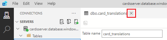 Screenshot showing how to click the X on the table designer tab to close the table designer for the card_translations table.