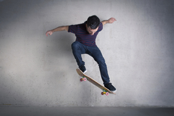 Diagram of a man on a skateboard.