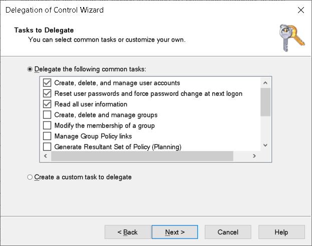 A screenshot of the Tasks to Delegate page in the Delegation of Control Wizard. The administrator has selected the tasks that relate to user management.