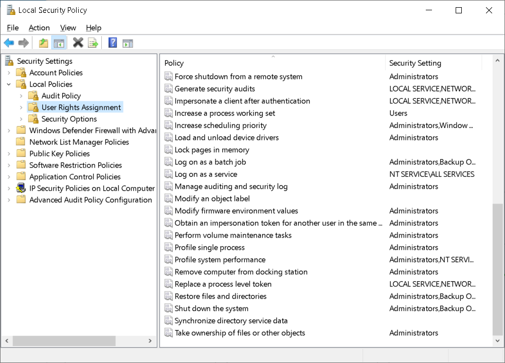 A screenshot of the Local Security Policy console. The administrator has selected the User Rights Assignment node, and displayed in the details pane are policies and security settings.