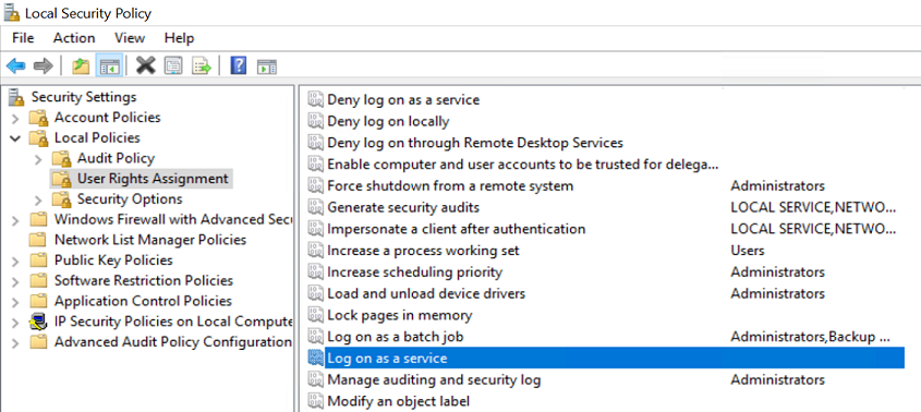 Screenshot of the Local Security Policy window, highlighting the 'Log on as a service' policy.