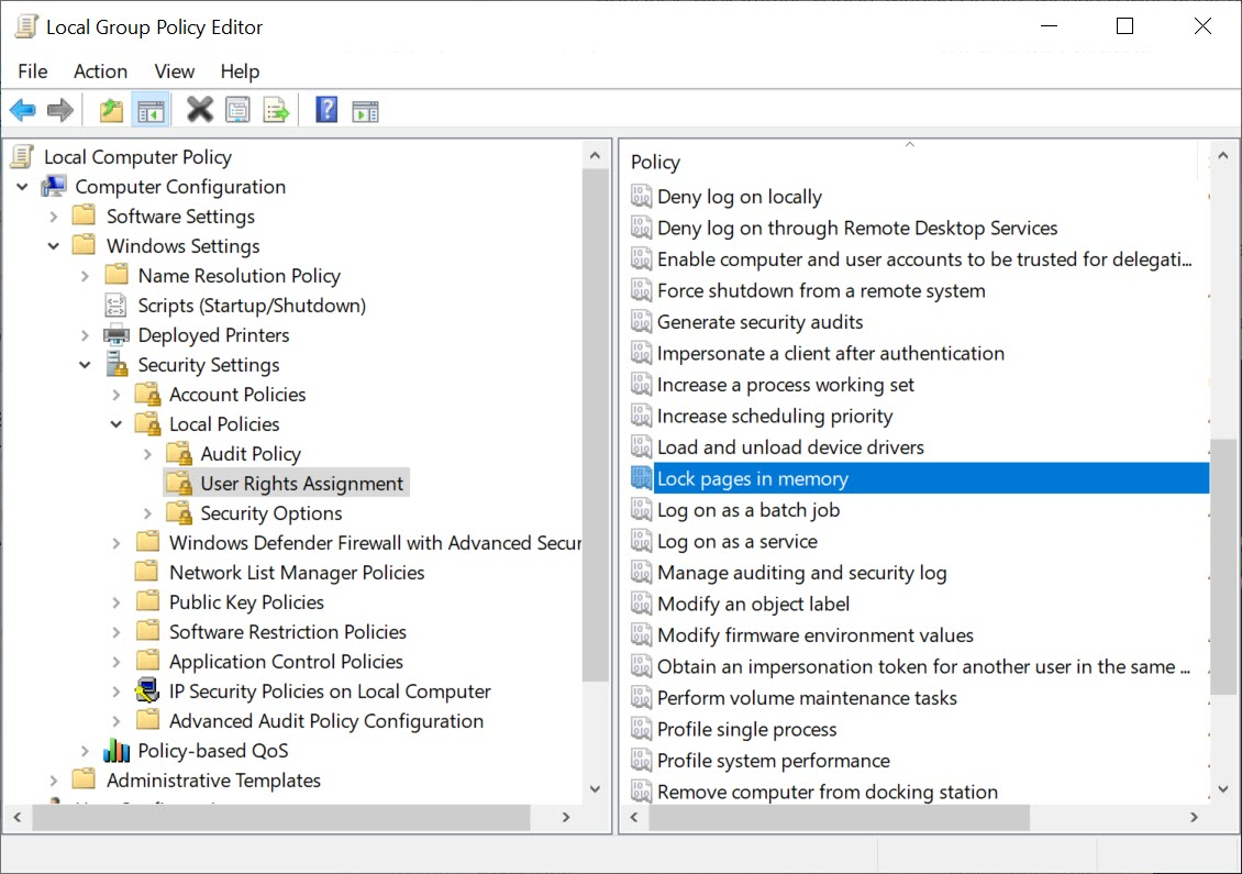 Screenshot of Local Group Policy Editor console where the lock pages in memory option in the User Rights Assignment folder is selected.