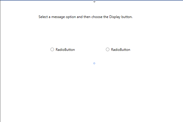 Screenshot of the Design window for Greetings.xaml, showing a TextBlock control and two RadioButton controls positioned on the design surface.