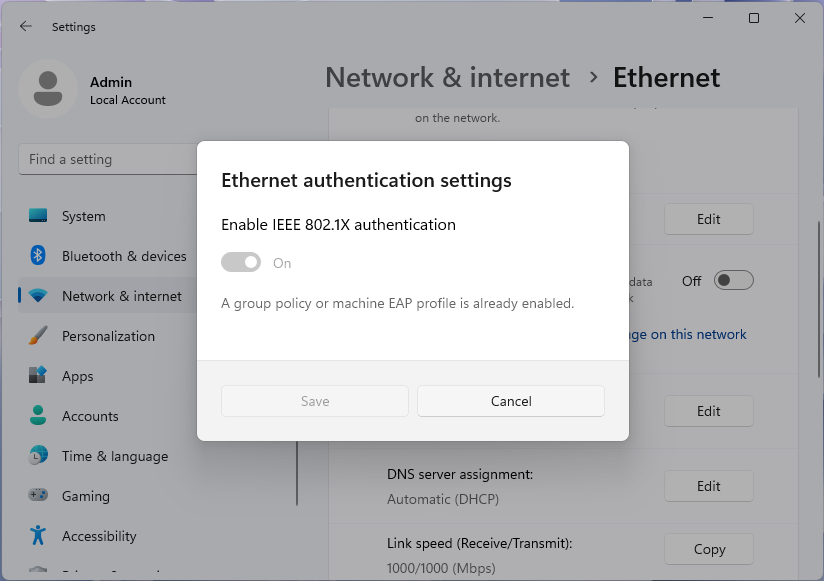 Screenshot of Ethernet authentication settings dialog, disabled by group policy, in Windows 11 settings app.