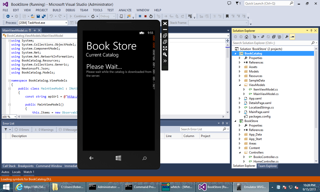 Screenshot of the solution explorer window, showing the phone emulator pop up over it, displaying the title Book Store and the 'please wait' message.