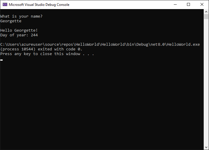 Captura de pantalla de la ventana Consola de depuración que muestra el mensaje de solicitud de un nombre, la entrada y la salida 