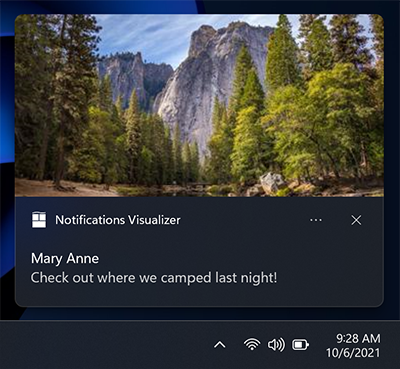 Captura de pantalla de una notificación de aplicación que muestra la posición de la imagen principal, encima del área de atribución.