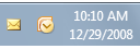 captura de pantalla del área de notificación y los iconos de Outlook 