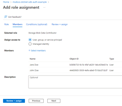 A screenshot showing the completed Add role assignment page and the location of the Review + assign button used to complete the process.